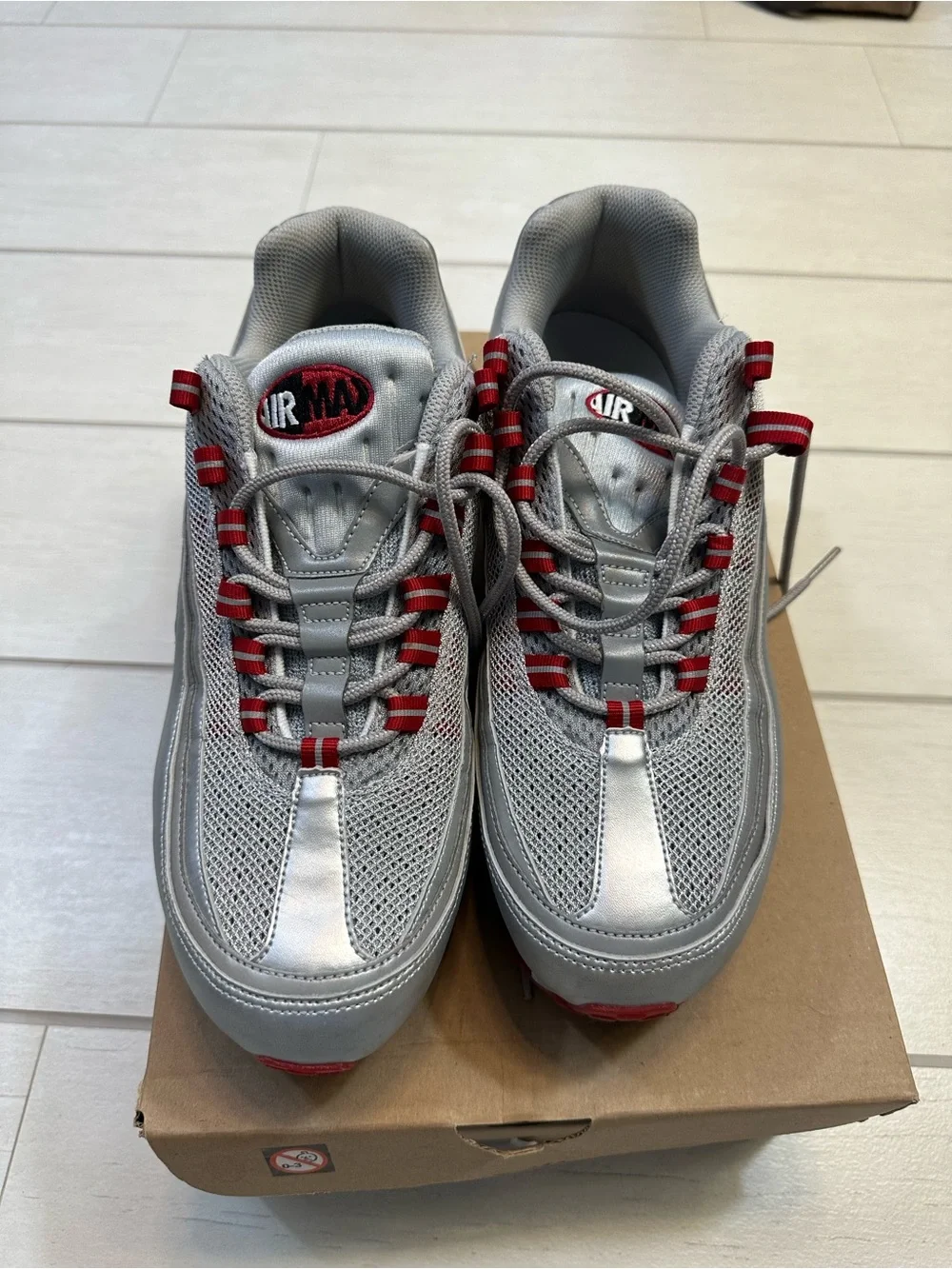 Nike Air Max 24-7 Metallic Silver with Red Accents